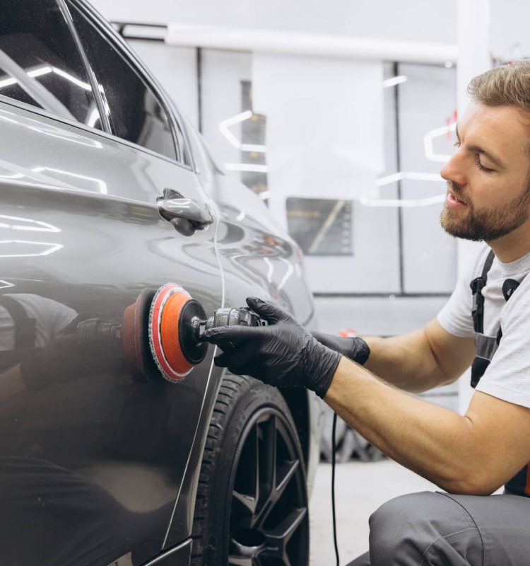 professional-car-detailing-with-an-auto-polisher-in-a-garage-setting.jpg