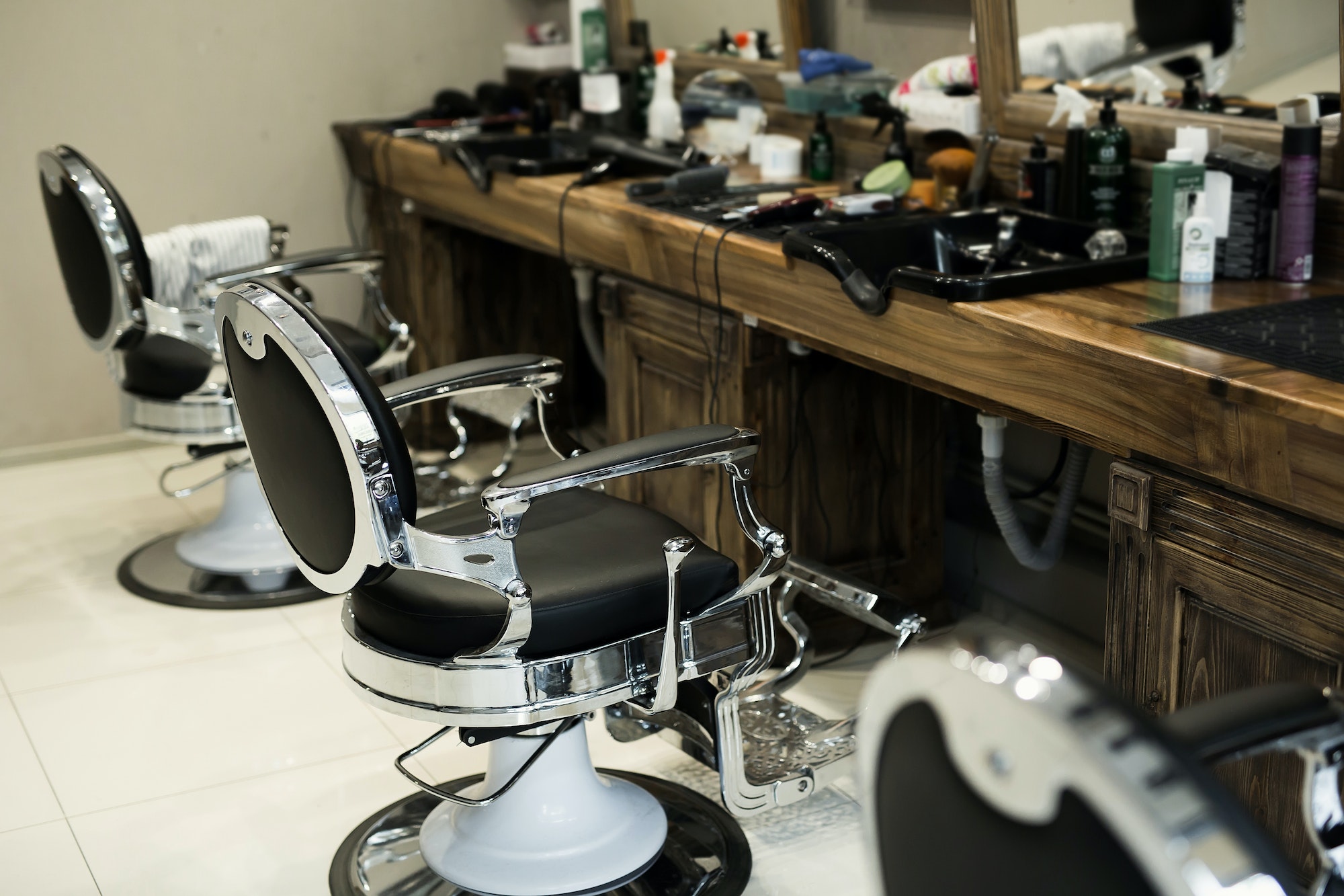 stylish-modern-barber-chairs-in-black-and-grey-barbershop-interior.jpg