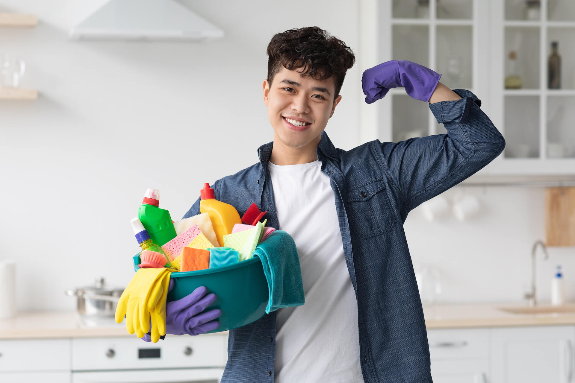 positive-asian-guy-with-cleaning-supplies-showing-2021-09-02-21-27-13-utc.jpg