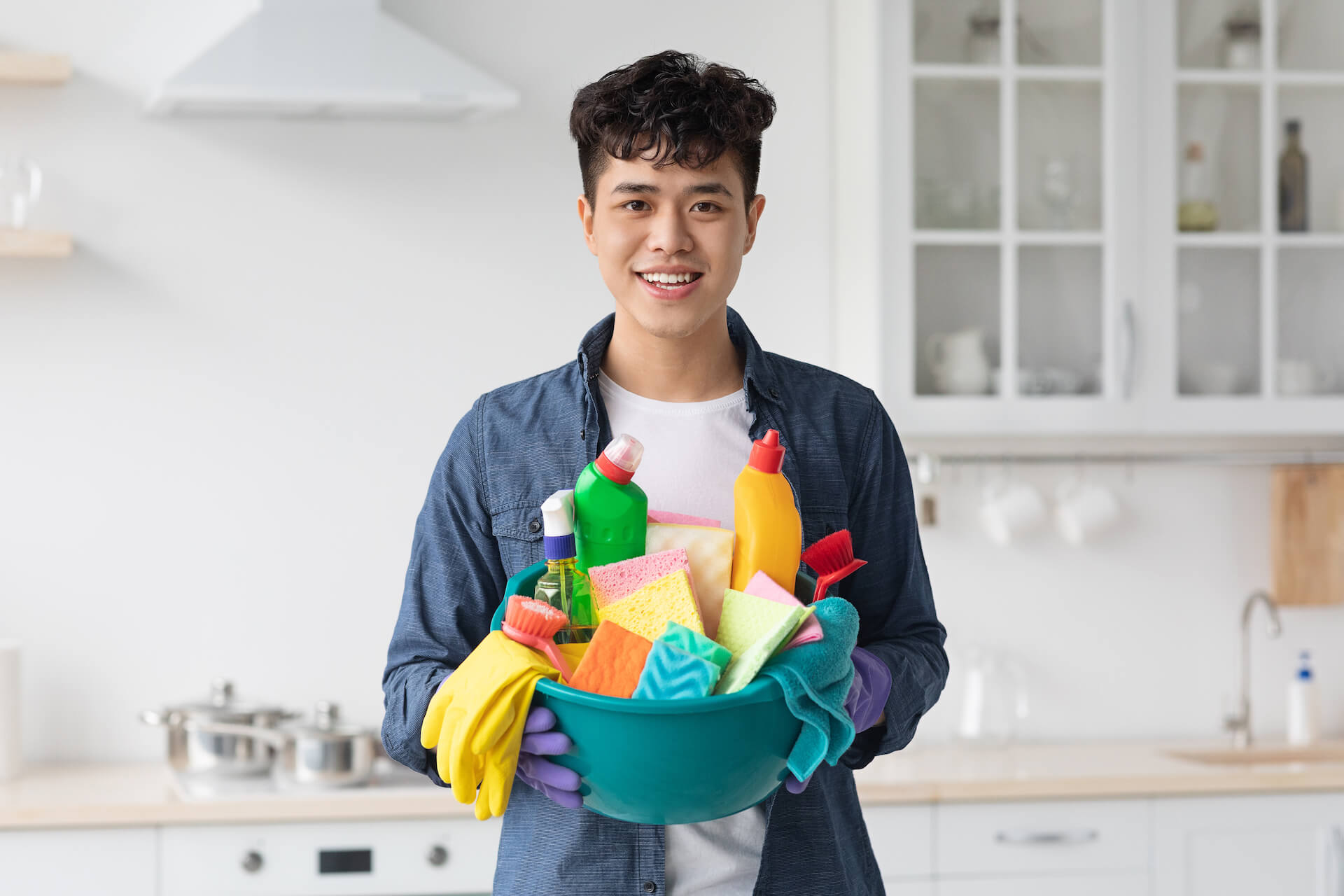 smiling-asian-guy-house-keeper-cleaning-apartment-2021-09-03-14-20-57-utc.jpg