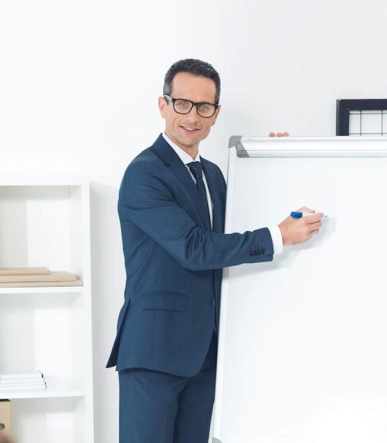 smiling-mature-businessman-giving-presentation-at-2022-11-02-02-01-41-utc-e1671073296999.jpg